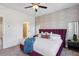 Comfortable main bedroom with a stylish accent wall, ceiling fan, and ensuite bathroom access at 310 Mcdonough Se Blvd # 104, Atlanta, GA 30315