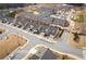 Aerial view of the community, displaying multiple homes and the surrounding neighborhood at 2101 Slick Stone Dr, Snellville, GA 30078