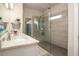 Elegant bathroom with a glass-enclosed shower, seating, and marble countertops at 2101 Slick Stone Dr, Snellville, GA 30078