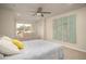 Bright bedroom featuring a bed, a seating area with a couch, and tasteful decorations at 2101 Slick Stone Dr, Snellville, GA 30078
