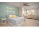 Bedroom featuring a bed, a seating area with a couch, and an ensuite bathroom at 2101 Slick Stone Dr, Snellville, GA 30078