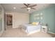 Bedroom featuring a bed, a seating area with a couch, and an ensuite bathroom at 2101 Slick Stone Dr, Snellville, GA 30078