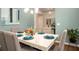 Charming dining room with faux marble-topped table, modern lighting, and decorative accents at 2101 Slick Stone Dr, Snellville, GA 30078