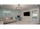 Comfortable living room with a large couch, a desk and a television screen on the wall at 2101 Slick Stone Dr, Snellville, GA 30078