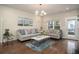 Comfortable living room with hardwood floors, stylish sofas, and decorative artwork at 2101 Slick Stone Dr, Snellville, GA 30078