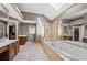 Luxurious primary bathroom with a soaking tub, double vanities, and a walk-in shower at 3388 Fieldwood Se Dr, Smyrna, GA 30080