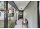 Inviting covered front porch features a bench, charming decorations, and clear house numbers at 2057 Bixler Cir, Decatur, GA 30032