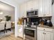 This kitchen includes updated appliances, lots of storage, and views into the dining room at 2057 Bixler Cir, Decatur, GA 30032
