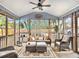 Cozy screened-in sunroom with comfortable seating and a ceiling fan, perfect for relaxation and enjoying the outdoors at 2057 Bixler Cir, Decatur, GA 30032