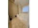 Bathroom featuring a tiled floor and large bathtub with jets at 8056 S Bay Ct, Riverdale, GA 30274