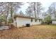 A private backyard featuring a brick house and a partially fenced yard at 3511 Misty Valley Rd, Decatur, GA 30032