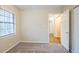 Bedroom featuring a closet, a hallway view, and a window with blinds at 3511 Misty Valley Rd, Decatur, GA 30032