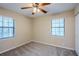 Bedroom showcasing carpet, natural light through windows with blinds, and a ceiling fan at 3511 Misty Valley Rd, Decatur, GA 30032