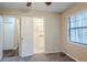 Bedroom featuring two entryways and view into attached bathroom with white vanity at 3511 Misty Valley Rd, Decatur, GA 30032