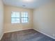Bright bedroom with neutral carpet and natural light from windows with blinds at 3511 Misty Valley Rd, Decatur, GA 30032