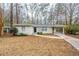 Charming single-story home with a well-maintained yard and covered parking area at 3511 Misty Valley Rd, Decatur, GA 30032