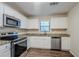 Stylish kitchen featuring granite countertops, stainless steel appliances, and white cabinets at 3511 Misty Valley Rd, Decatur, GA 30032