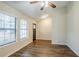The living room has lovely wood-look flooring, a ceiling fan, and a view of the front door at 3511 Misty Valley Rd, Decatur, GA 30032