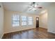 Cozy living area boasts wood-look flooring, a ceiling fan, and a view of the front entrance at 3511 Misty Valley Rd, Decatur, GA 30032