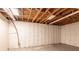 Unfinished basement with white walls, concrete floors, and exposed ceiling at 3527 Glenview Sw Cir, Atlanta, GA 30331