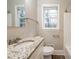 Bathroom with granite countertops and a window letting in natural light at 3527 Glenview Sw Cir, Atlanta, GA 30331