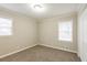 Bedroom featuring neutral walls, carpeted flooring, and natural light at 3527 Glenview Sw Cir, Atlanta, GA 30331