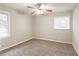Bedroom with carpeted floor, neutral walls, and ceiling fan at 3527 Glenview Sw Cir, Atlanta, GA 30331