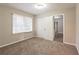Bedroom featuring plush carpeting, a closet, and a window for natural light at 3527 Glenview Sw Cir, Atlanta, GA 30331