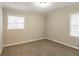 Bedroom with carpet, natural light from two windows, and neutral colored walls at 3527 Glenview Sw Cir, Atlanta, GA 30331
