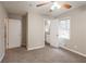 Cozy bedroom with neutral walls, carpeted flooring, and a ceiling fan at 3527 Glenview Sw Cir, Atlanta, GA 30331
