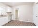 Cozy kitchen with white cabinets, stainless steel appliances, and granite countertops, offering a view into the next room at 3527 Glenview Sw Cir, Atlanta, GA 30331