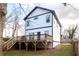 A view of the back of the home with a large deck and backyard space at 569 Hope Sw St, Atlanta, GA 30310