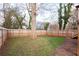 Backyard with a lush lawn and a tall wooden fence at 569 Hope Sw St, Atlanta, GA 30310