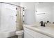 Clean bathroom featuring a shower-tub combo, white subway tile and modern fixtures at 569 Hope Sw St, Atlanta, GA 30310