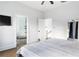 Bright bedroom shows door to shower and closet, hardwood flooring and neutral paint at 569 Hope Sw St, Atlanta, GA 30310