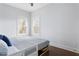 Bright bedroom with hardwood floors and two sunny windows overlooking the outdoors at 569 Hope Sw St, Atlanta, GA 30310