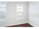 Well-lit walk-in closet with adjustable shelving and hardwood floors at 569 Hope Sw St, Atlanta, GA 30310