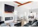 Spacious living area with hardwood floors, a fireplace, and a view of the dining area at 569 Hope Sw St, Atlanta, GA 30310