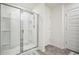 Modern bathroom with glass-enclosed shower, tile floor, and neutral color scheme at 815 Taurus Dr, Stockbridge, GA 30281