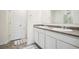Bathroom with double sinks, ample counter space, and tile flooring at 815 Taurus Dr, Stockbridge, GA 30281