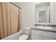 Bathroom featuring tub with shower, neutral tiling and vanity with sink at 815 Taurus Dr, Stockbridge, GA 30281