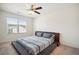 Spacious bedroom with a modern platform bed, large window, and ceiling fan at 815 Taurus Dr, Stockbridge, GA 30281