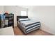 Bedroom with a dark headboard, natural light and a large closet shelf at 815 Taurus Dr, Stockbridge, GA 30281