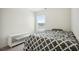 Cozy bedroom with a comfortable bed, natural light from the window, and neutral carpet at 815 Taurus Dr, Stockbridge, GA 30281