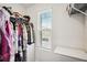 Well-organized walk-in closet with shelving, hanging rods, and a window for natural light at 815 Taurus Dr, Stockbridge, GA 30281