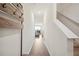 Inviting hallway with light wood flooring and a convenient coat rack leading to a bright living space at 815 Taurus Dr, Stockbridge, GA 30281