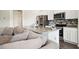 Modern kitchen featuring a granite island, stainless steel appliances, and open layout for entertaining at 815 Taurus Dr, Stockbridge, GA 30281