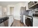 Modern kitchen featuring stainless steel appliances, granite countertops, and stylish backsplash at 815 Taurus Dr, Stockbridge, GA 30281