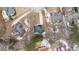 An aerial view shows the house among other single Gathering homes and mature trees at 130 Brookridge Ct, Fayetteville, GA 30215