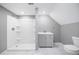 Bathroom with a walk-in shower, single sink vanity, and marble-like tile floor at 130 Brookridge Ct, Fayetteville, GA 30215